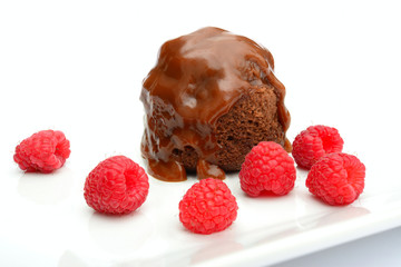 Chocolate caramel pudding with raspberries