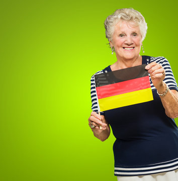 Happy Senior Woman Holding Germany Flag