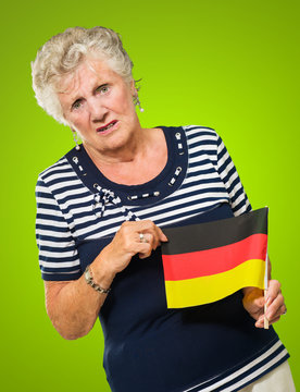 Happy Senior Woman Holding Germany Flag