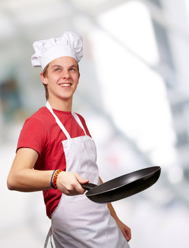 Portrait Of A Chef Holding Pan