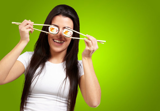 Portrait Of A Female Holding Sushi Roll