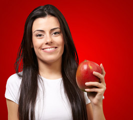 A Young Woman Holding A Mango