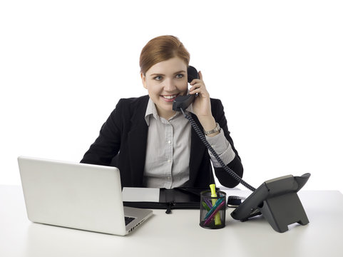 happy office clerk talking on the telephone
