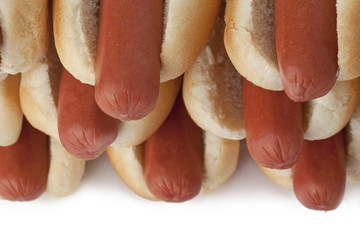 heap of hotdog sandwiches close up