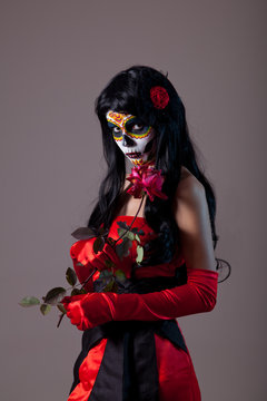 Sugar skull lady with red rose