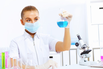 Young female scientist working in laboratory