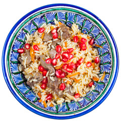 top view on traditional asian pilaf with pomegranate