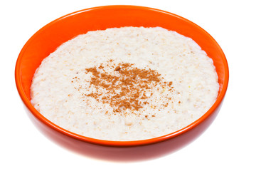 oat porridge with cinnamon in orange bow