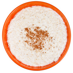 traditional english oat porridge with cinnamon in orange bow