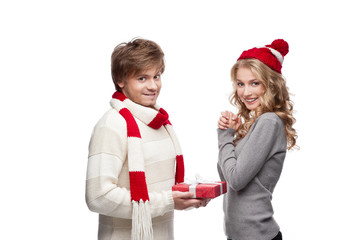 cute man presenting christmas gift to woman