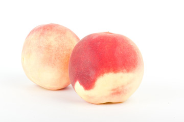 fresh peach fruits on white