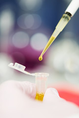 Dropper with drop of medicine at laboratory
