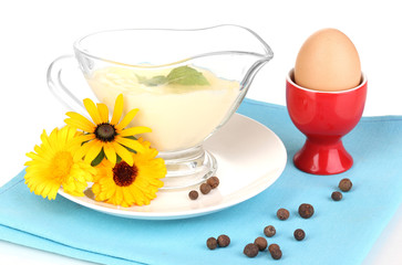 Mayonnaise in bowl on napkin isolated on white