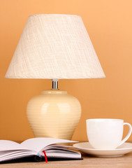 table lamp and cup on beige background