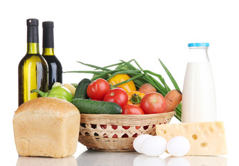 Composition with vegetables  in wicker basket isolated on white