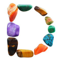 Letter D spelled with semi-precious stones