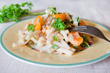 Fresh salad with apple, mandarine and parsley
