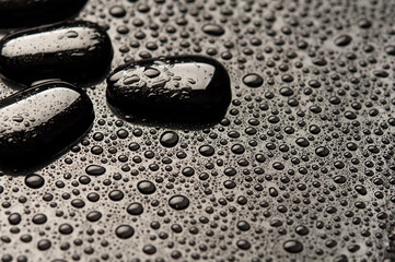 black stones and pebbles with water drops