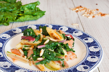 Fresh salad with chard and pine nuts