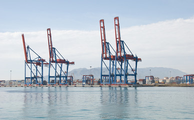 Cargo ship loading containers.