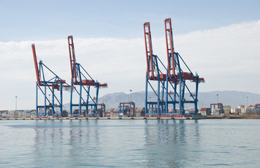 Cargo ship loading containers.