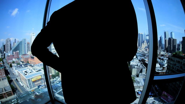 Caucasian female manager has business call in Manhattan office centre