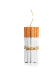 Cigarettes tied with rope and wick isolated on white