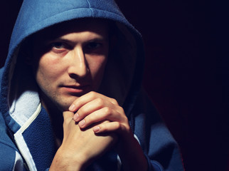 Low-key portrait of young man