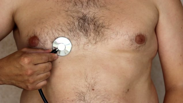 using a stethoscope to listen to a  patient's chest