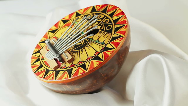 Musical Instrument kalimba rotates on a white background