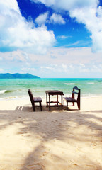 Table and chairs at the beach