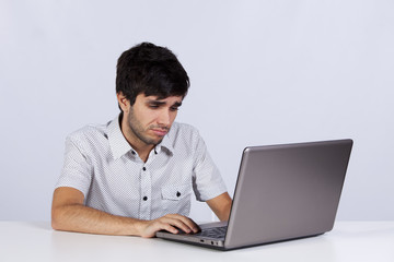 Young working with his laptop