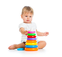 Obraz premium adorable baby playing with color toy
