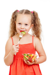 child girl eating healthy food vegetables