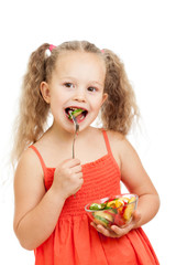 child girl eating healthy food vegetables