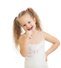 child girl cleaning teeth and smiling, isolated on white backgro