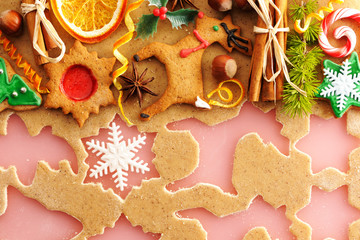 Christmas spices and cookies over gingerbread dough