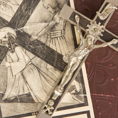 Silver cross and old holy bible