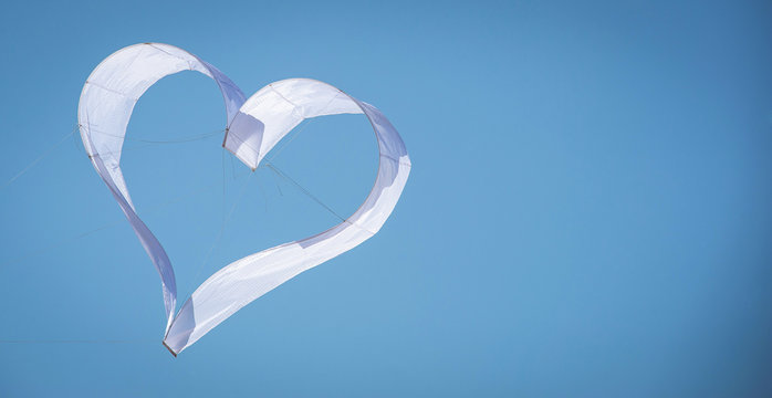 Heart kite in the blue sky with copy space.