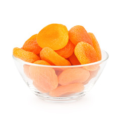 Glass bowl with dried apricots isolated on white background