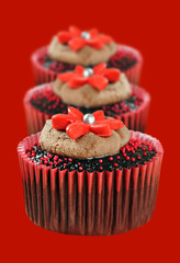 Chocolate cupcakes in red cups
