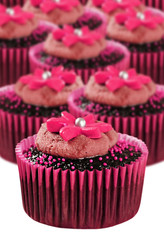 Delicious chocolate cupcakes in pink cups
