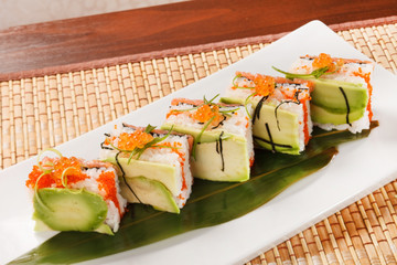 tasty sushi with avocado