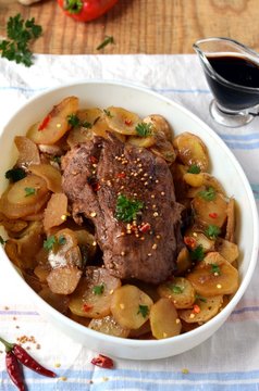 Meat baked with potatoes