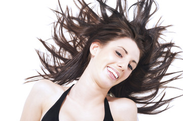 Laughing carefree woman l tossing her hair
