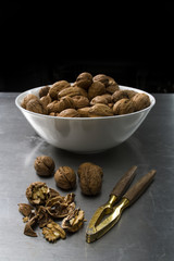 bowl with walnuts and a nut cracker