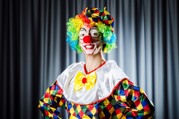 Funny clown in the studio shooting