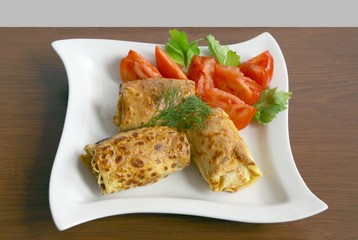 croquettes with meat and tomato salad as dinner meal