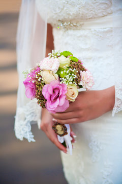 wedding bouquet in the bride's hands