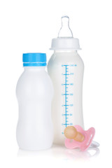 Baby yoghurt, milk bottle and pacifier